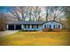 Charming single-story home with a two-car garage and a well-maintained front yard at 5409 Mill Valley Dr, Douglasville, GA 30135