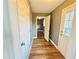 Hallway with multiple doors and entrance to a walk-in closet and porch at 5409 Mill Valley Dr, Douglasville, GA 30135