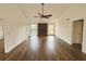 Bright and airy living room with wood floors, ceiling fan, and brick fireplace at 5409 Mill Valley Dr, Douglasville, GA 30135