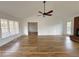 Open living room with hardwood floors, a brick fireplace, and neutral paint at 5409 Mill Valley Dr, Douglasville, GA 30135