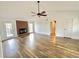 Spacious living room with hardwood floors, brick fireplace, and natural light at 5409 Mill Valley Dr, Douglasville, GA 30135