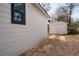 View of the detached garage with driveway on the side of the home at 1449 Athens Sw Ave, Atlanta, GA 30310