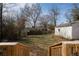 Backyard with grass and view of houses in the neighborhood at 1449 Athens Sw Ave, Atlanta, GA 30310