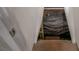 Stairway leading down to a crawlspace with a tarp for cover at 1449 Athens Sw Ave, Atlanta, GA 30310