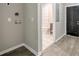 Hallway featuring a doorway leading to a bathroom with a shower-tub combo at 1449 Athens Sw Ave, Atlanta, GA 30310