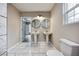 A bright bathroom features double sinks and marble floors at 1449 Athens Sw Ave, Atlanta, GA 30310