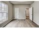 A bright bedroom features wood-look flooring and a view of outdoors at 1449 Athens Sw Ave, Atlanta, GA 30310