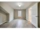 A finished bedroom features wood-look floors and a view outside at 1449 Athens Sw Ave, Atlanta, GA 30310