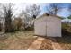 A white garage sits at the end of a concrete driveway at 1449 Athens Sw Ave, Atlanta, GA 30310