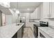 Spacious kitchen with white cabinets, stainless steel appliances, and granite countertops at 1449 Athens Sw Ave, Atlanta, GA 30310