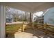 Cozy porch with natural wood railing and neighborhood views at 1449 Athens Sw Ave, Atlanta, GA 30310