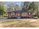 Brick ranch house with a landscaped yard at 305 Brookwood Dr, Marietta, GA 30064