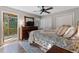 Main bedroom with king-size bed and access to a private deck at 305 Brookwood Dr, Marietta, GA 30064