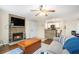 Living room with fireplace and kitchen view at 813 Dunes Way, Alpharetta, GA 30022