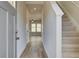 Bright entryway with hardwood floors and staircase leading upstairs at 20 Camellia Dr, Fairburn, GA 30213