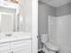 Clean bathroom with white vanity, shower, and toilet at 4534 Parkway Cir, Atlanta, GA 30349