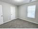Bright bedroom with grey carpet and neutral walls at 4534 Parkway Cir, Atlanta, GA 30349