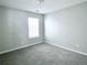 Well-lit bedroom with grey carpet and window at 4534 Parkway Cir, Atlanta, GA 30349