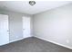 Simple bedroom with carpet, neutral walls and double door closet at 4534 Parkway Cir, Atlanta, GA 30349