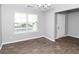 Bright dining area with large window and wood-look tile flooring at 4534 Parkway Cir, Atlanta, GA 30349