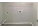 Laundry room with shelving and vinyl flooring at 4534 Parkway Cir, Atlanta, GA 30349