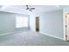 Spacious main bedroom featuring ceiling fan and walk-in closet at 4534 Parkway Cir, Atlanta, GA 30349