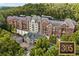 Luxury condo building with upscale exterior and landscaping at 3280 Stillhouse Se Ln # 305, Atlanta, GA 30339
