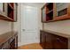 Butler's pantry with wooden cabinets and countertop space, perfect for serving and storage at 3280 Stillhouse Se Ln # 305, Atlanta, GA 30339