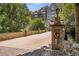 The Greystone condo entrance with stonework and landscaping at 3280 Stillhouse Se Ln # 305, Atlanta, GA 30339