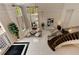 Foyer features soaring ceilings, large windows, marble floors and a curved staircase with wrought iron railing at 3280 Stillhouse Se Ln # 305, Atlanta, GA 30339
