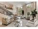 Bright open foyer features soaring ceilings, large windows, marble floors and a staircase with decorative wrought iron railing at 3280 Stillhouse Se Ln # 305, Atlanta, GA 30339