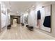 Hallway featuring tiled floors, abstract art, and stone archway, creating an artful ambiance at 3280 Stillhouse Se Ln # 305, Atlanta, GA 30339