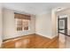 Living room with hardwood floors, neutral paint, and window at 3280 Stillhouse Se Ln # 305, Atlanta, GA 30339
