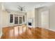 Bright living room with hardwood floors, fireplace, and large windows offering natural light at 3280 Stillhouse Se Ln # 305, Atlanta, GA 30339