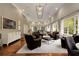 Elegant living room with hardwood floors, large windows, and ample seating for entertaining guests at 3280 Stillhouse Se Ln # 305, Atlanta, GA 30339