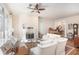 Spacious living room with a fireplace, hardwood floors, and elegant furnishings at 3280 Stillhouse Se Ln # 305, Atlanta, GA 30339