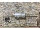 Outdoor grill with a stone background, perfect for summer barbecues and entertaining at 3280 Stillhouse Se Ln # 305, Atlanta, GA 30339