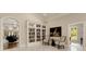 Elegant sitting room with bookshelves, seating, and access to other rooms through arched doorways at 3280 Stillhouse Se Ln # 305, Atlanta, GA 30339