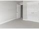 Grey carpeted bedroom with white doors at 490 Paces Dr, Lithia Springs, GA 30122