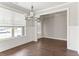 Dining room with hardwood floors, chandelier and wainscoting at 490 Paces Dr, Lithia Springs, GA 30122