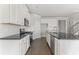 Modern kitchen with white cabinets and granite countertops at 490 Paces Dr, Lithia Springs, GA 30122