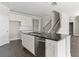 Modern kitchen with island, stainless steel appliances, and dark countertops at 490 Paces Dr, Lithia Springs, GA 30122