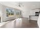 Open concept living room with hardwood floors and kitchen access at 490 Paces Dr, Lithia Springs, GA 30122