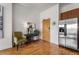 Bright entryway with hardwood floors, a green chair, and stainless steel appliances at 384 Ralph Mcgill Ne Blvd # 404, Atlanta, GA 30312