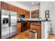 Modern kitchen with stainless steel appliances and wood cabinets at 384 Ralph Mcgill Ne Blvd # 404, Atlanta, GA 30312