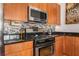 Modern kitchen with stainless steel appliances and a black countertop at 384 Ralph Mcgill Ne Blvd # 404, Atlanta, GA 30312