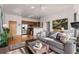 Open living room features hardwood floors, modern furniture, and a kitchen with stainless steel appliances at 384 Ralph Mcgill Ne Blvd # 404, Atlanta, GA 30312