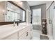 Modern bathroom with a large mirror, double vanity, and walk-in shower at 1072 Brookglynn Trce, Decatur, GA 30032