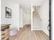 Inviting entryway with light wood floors and staircase, exudes modern elegance at 1072 Brookglynn Trce, Decatur, GA 30032