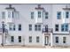 Attractive exterior featuring white brick, dark trim, and private balconies at 1072 Brookglynn Trce, Decatur, GA 30032